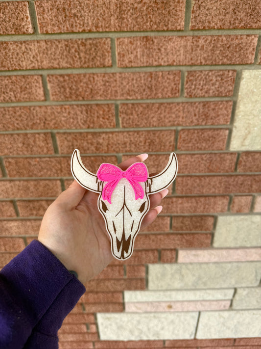 Cow skull with bow